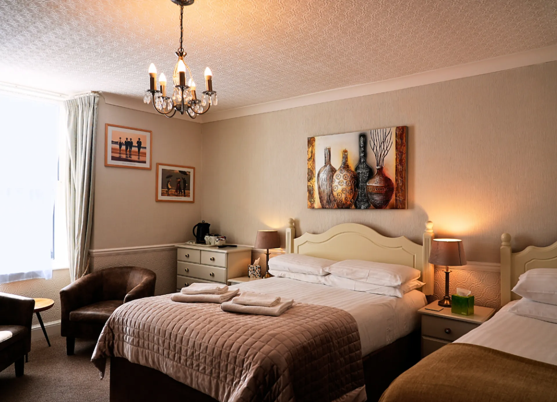 Inside one of the stunning rooms inside The Thornhill in Teignmouth, featuring a grand double bed.